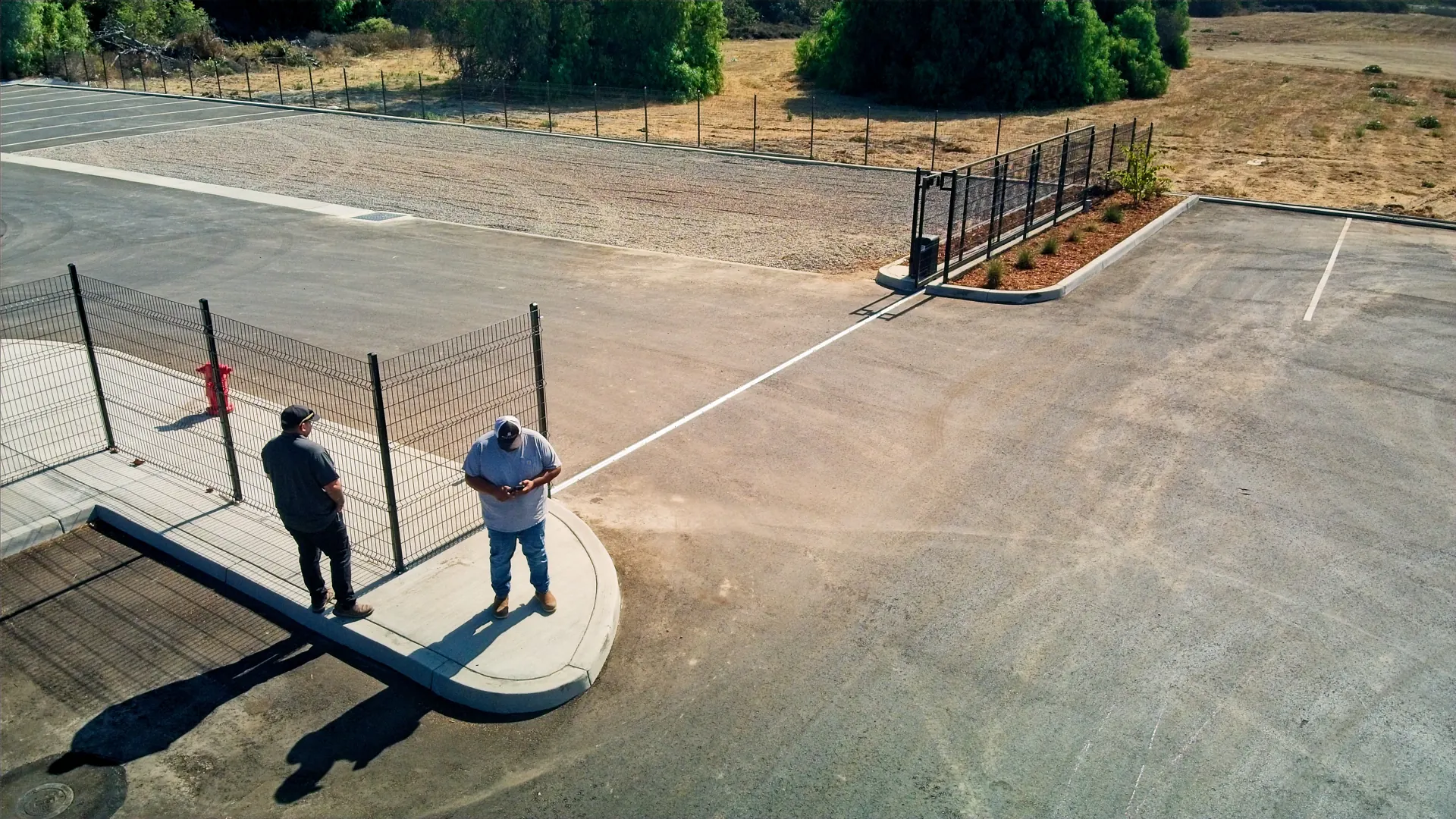Walk-through of a completed commercial fence and gate install
